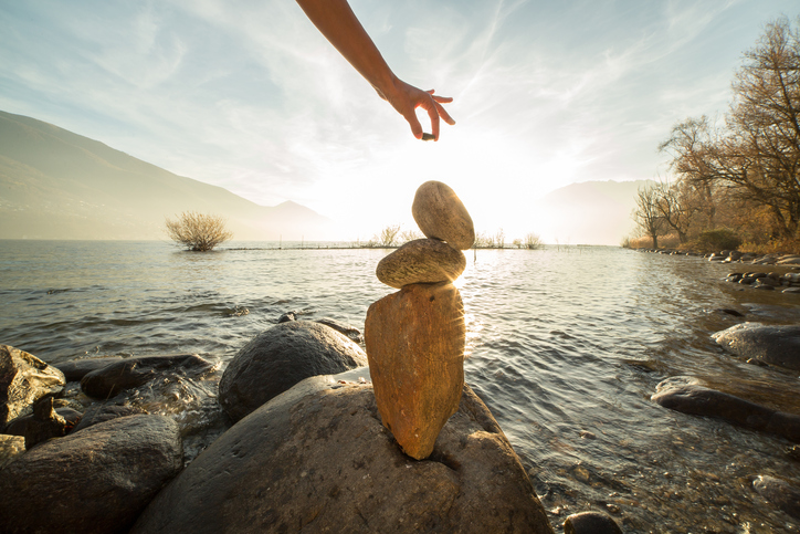 Detail-of-person-stacking-rocks-by-the-lake-501794084_727x484-1.jpeg